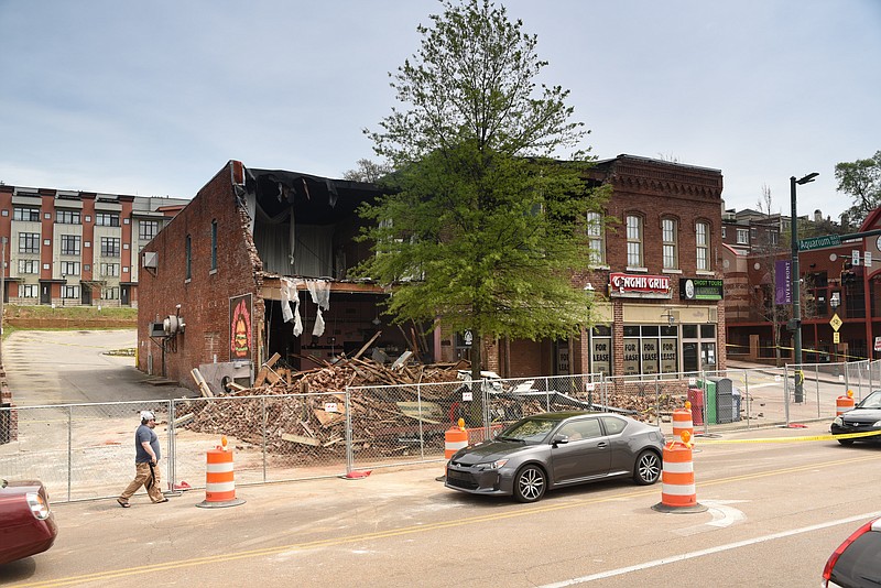 Staff file photo by Tim Barber Partially collapsed building at Market Street and Aquarium Way is surrounded by a temporary fence.