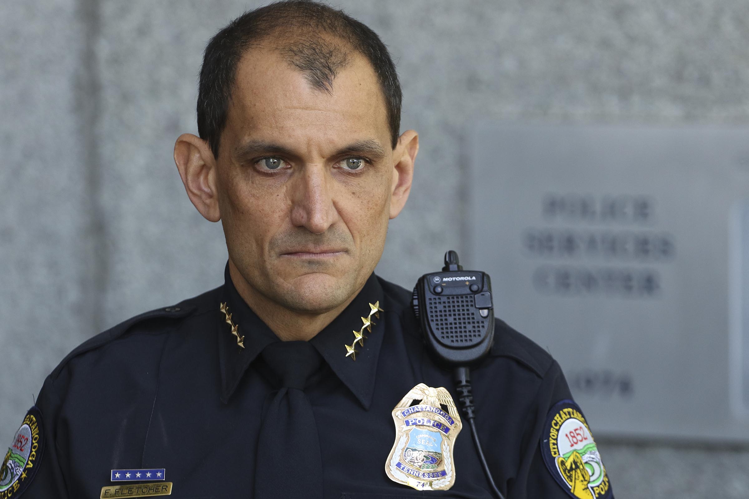 Staff Photo by Dan Henry / The Chattanooga Times Free Press- 4/7/17. Chattanooga Police Department (CPD) Chief Fred Fletcher listens to Mayor Andy Berke say complimentary things about him just after Chief Fletcher announced that he will retire later this summer, once his three year contract with the City of Chattanooga is fulfilled.