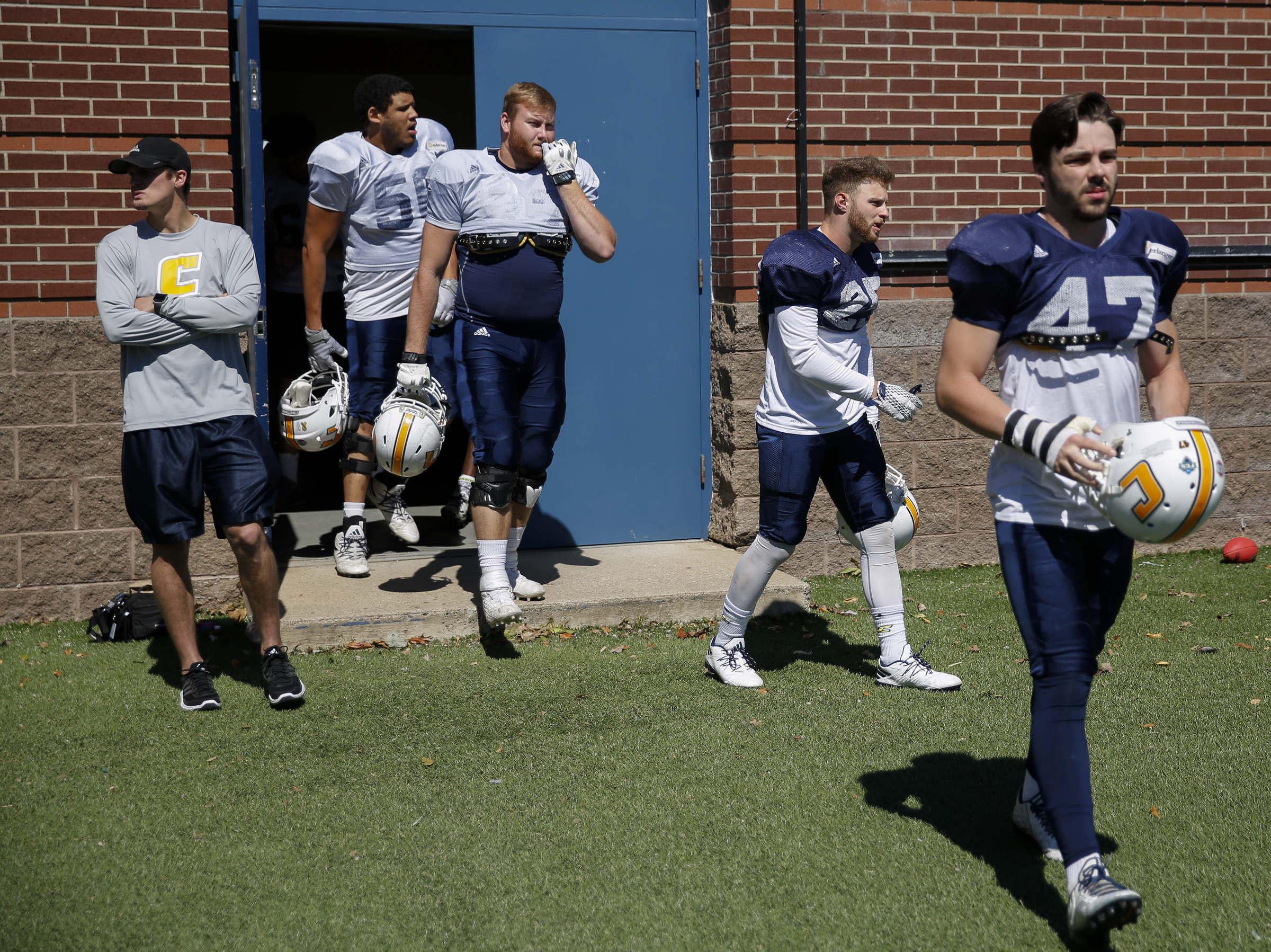 Players take the field for UTC's spring football game day at Finley Stadium on Saturday, April 8, 2017, in Chattanooga, Tenn. This year's spring game was an open practice followed by a 40 minute scrimmage.