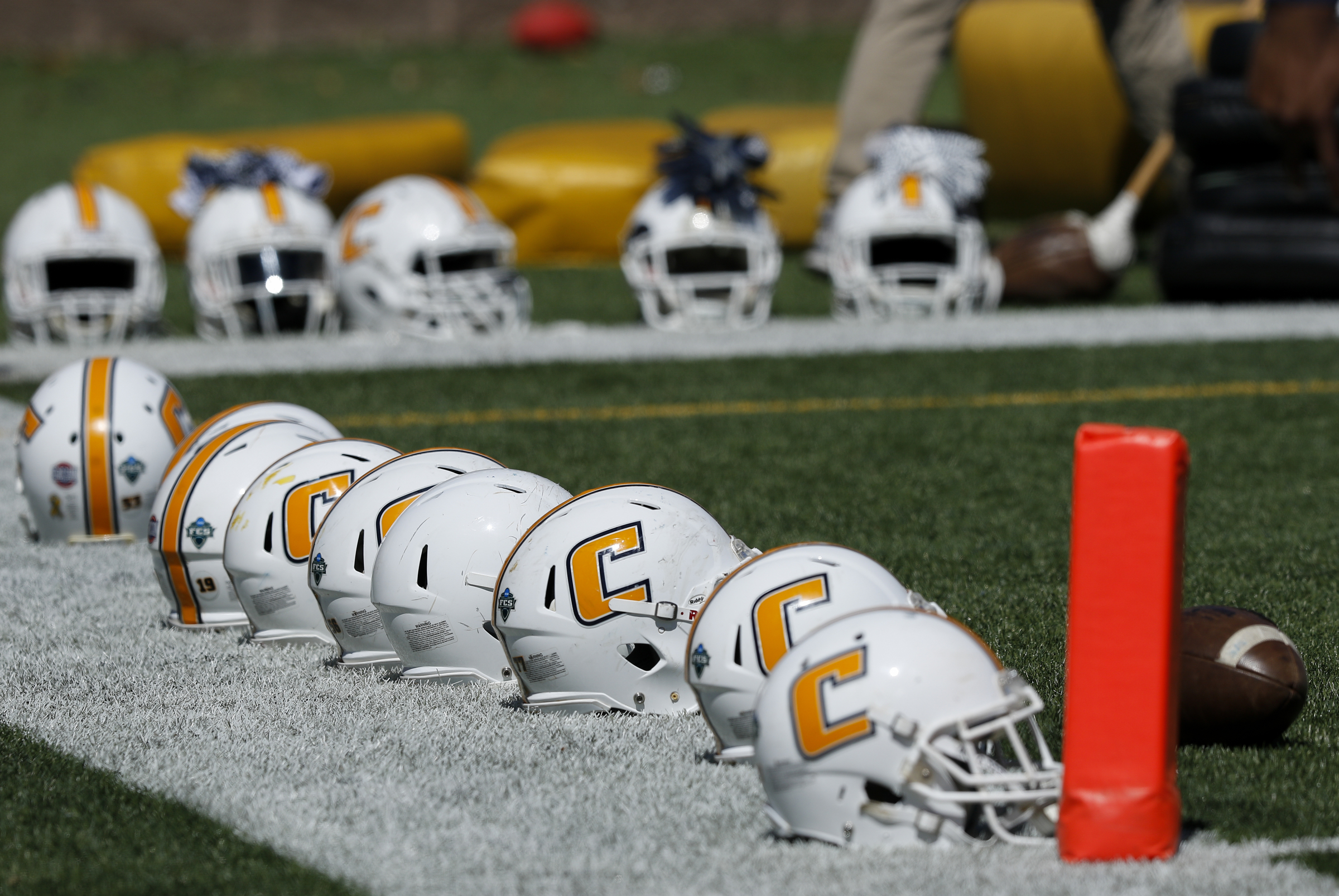 Helmets are laid out during UTC's spring football game day at Finley Stadium on Saturday, April 8, 2017, in Chattanooga, Tenn. This year's spring game was an open practice followed by a 40 minute scrimmage.