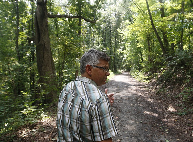 Staff File Photo by Doug Strickland / Rick Wood walks along a trail while giving a tour of Stringer's Ridge Park on Tuesday, Sept. 3, 2013, in Chattanooga, Tenn.