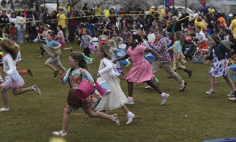 Children make a mad dash for eggs during the 2016 Easter at Coolidge event.