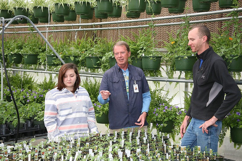 Dixie Floyd, David Warren and Chase Bohannon, from left, go over plant identification at Georgia Northwestern Technical College in preparation for the spring plant sale that starts April 18 on the Floyd County campus, Maurice Culberson Drive, Rome, Ga. For more information: 706-291-3350.