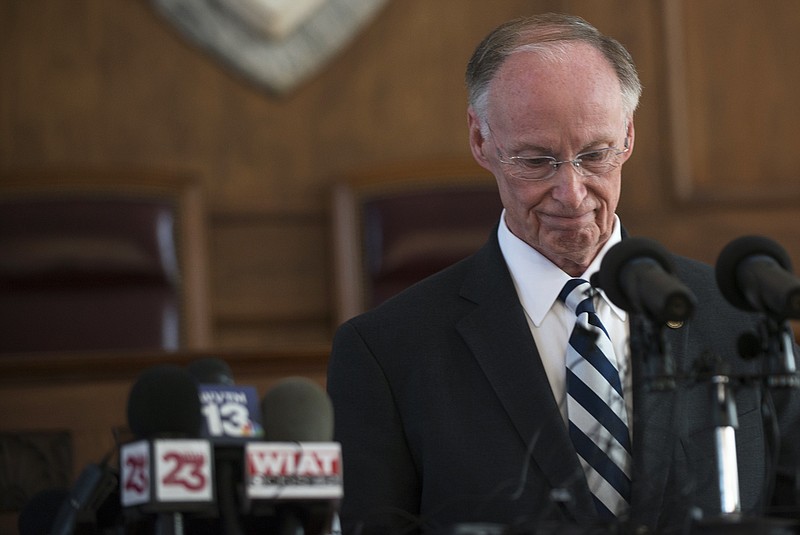 
              Former Alabama Governor Robert Bentley speaks after officially resigning on Monday, April 10, 2017, in Montgomery, Ala. Bentley resigned Monday rather than face impeachment and pleaded guilty to two misdemeanor campaign violations that arose during an investigation of his alleged affair with a top aide.
(Albert Cesare/The Montgomery Advertiser via AP)
            