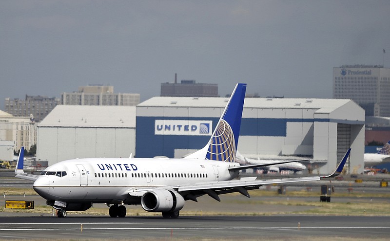 
              FILE - In this Sept. 8, 2015, file photo, a United Airlines passenger plane lands at Newark Liberty International Airport in Newark, N.J. Twitter users are poking fun at United's tactics in having a man removed from an overbooked Chicago to Louisville flight on April 9, 2017.  (AP Photo/Mel Evans, File)
            