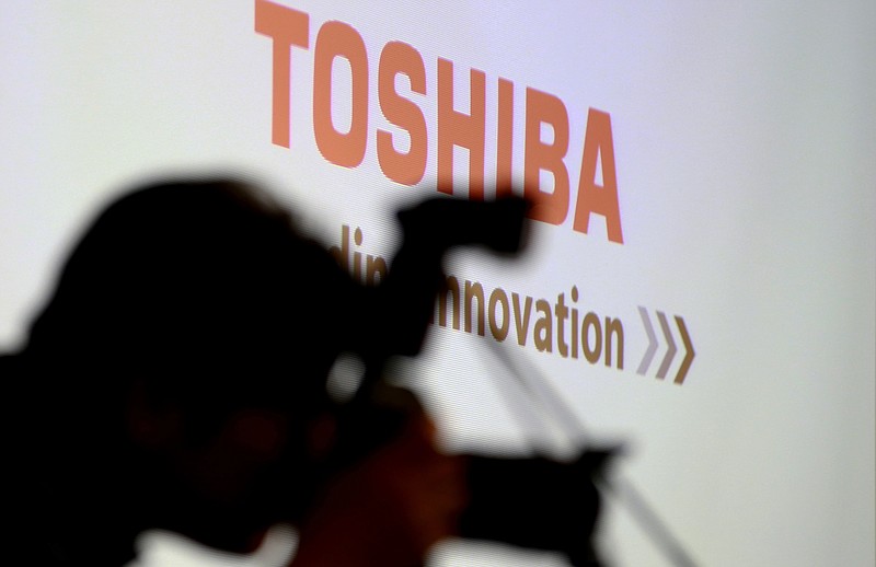 
              A photographer takes a photo before a press conference at the Toshiba Corp.'s headquarters in Tokyo, Tuesday, April 11, 2017. Toshiba, whose U.S. nuclear unit Westinghouse Electric Co. has filed for bankruptcy protection, said Tuesday it expects a loss of 1.01 trillion yen ($9.2 billion) for the fiscal year that ended in March. (AP Photo/Shizuo Kambayashi)
            