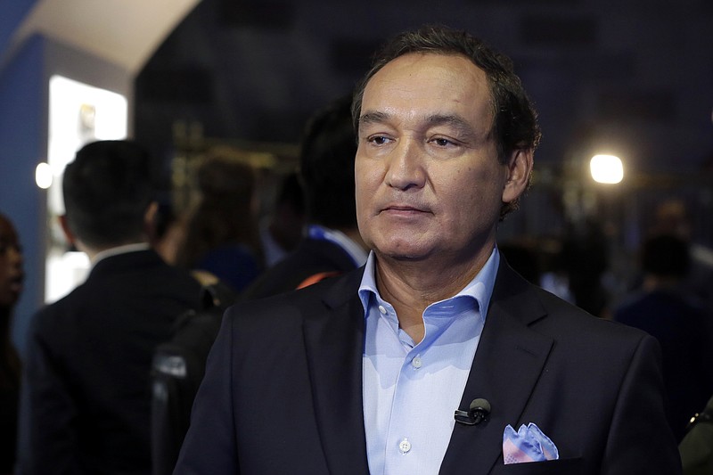 In this Thursday, June 2, 2016, file photo, United Airlines CEO Oscar Munoz waits to be interviewed, in New York, during a presentation of the carrier's new Polaris service, a new business class product that will become available on trans-Atlantic flights. Munoz said in a note to employees Tuesday, April 11, 2017, that he continues to be disturbed by the incident Sunday night in Chicago, where a passenger was forcibly removed from a United Express flight. Munoz said he was committed to "fix what's broken so this never happens again." (AP Photo/Richard Drew, File)