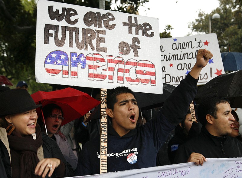 College students who are children of illegal immigrants rally in California for provisional legal status.