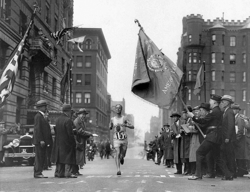 
              FILE - In this April 19, 1930 file photo, veteran marathoner Clarence DeMar, of the Melrose American Legion Post, crosses the finish line to win the Boston Marathon in the last of his record seven wins in Boston. A new film that captures much of the Boston Marathon's colorful history premieres Saturday, April 15, 2017, in conjunction with the 121st running of the race on Monday. (AP Photo, File)
            