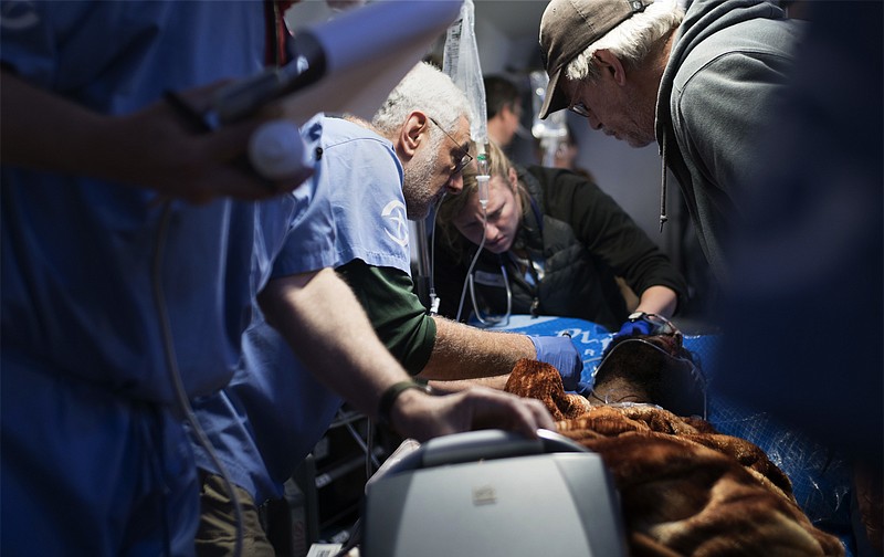 
              In this March 23, 2017 photo, American medical volunteers attend to a civilian casualty of the battle to retake Mosul from Islamic State militants, at the the Samaritan’s Purse field hospital, in Bartella, Iraq. Situated on the outskirts of Mosul, the state-of-the-art field clinic was set up last December by Samaritan’s Purse, a Christian aid organization based in Boone, North Carolina. Its volunteer doctors receive those with the gravest injuries from the field clinics inside or at the very edge of Mosul, where casualties are initially treated. (AP Photo/Tomislav Skaro)
            