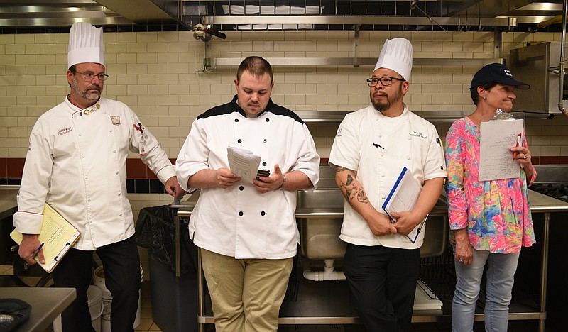 Bill Wright, Virginia College chef instructor, Jeremy Jernigan, culinary instructor with Wilson Central High, Sarah Jonas, with the Whitfield County Health Department and Dao Le, executive chef at the Doubletree Hotel, from left, watch students cook Monday, April  10, 2017 at Virginia College during a high school cooking competition.