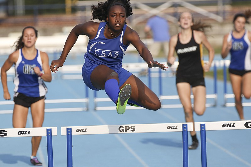 CSAS senior Lennex Walker heads toward the finish line and a victory in the 300-meter hurdles during Friday's Optimist track and field meet at GPS. Walker also won the 100 hurdles and the triple jump, and she was second in the long jump.