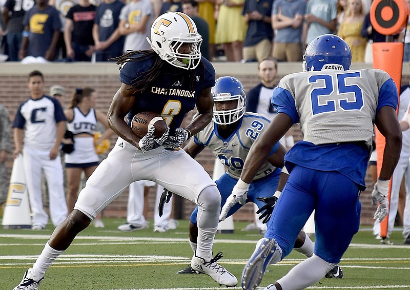 UTC wide receiver Alphonso Stewart prepares to dive into the end zone for a touchdown during the 2016 season opener against Shorter. Off the field, Stewart is providing behind-the-scenes help for other UTC sports.