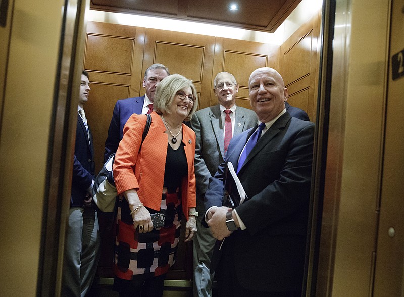 
              FILE - In this March 24, 2017, file photo, House Budget Chair Diane Black, R-Tenn., and Ways and Means Chairman Kevin Brady, R-Texas, key stewards of the Republican health care overhaul legislation, board an elevator off the House chamber after GOP leadership decided to pull the troubled bill off the House floor. Black had widely been expected to try to use the health care law as a springboard for a gubernatorial bid in Tennessee. (AP Photo/J. Scott Applewhite, File)
            