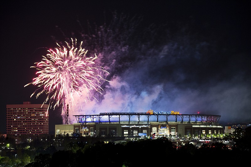 Fireworks go off over SunTrust Park after the Atlanta Braves defeated the San Diego Padres in a baseball game in Atlanta, Friday, April 14, 2017. The Braves played their first regular-season game Friday in SunTrust Park, the new suburban stadium that replaced Turner Field. (AP Photo/David Goldman)

