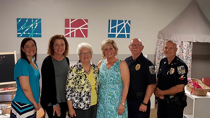 Betsy Peters, Chattanooga Family Justice Center Director Dr. Valerie Radu, the Rev. Brenda Carroll, the Rev. Amy Nutt, Red Bank Police Chief Tim Christol and Sgt. Rusty Aalburg, from left, stand in the Family Justice Center's satellite location in Red Bank, which opened last year at White Oak Methodist Church. Red Bank is applying for a federal grant that would fund the hiring of a victim service coordinator to work in conjunction with the RBPD and other small police agencies north of the river.