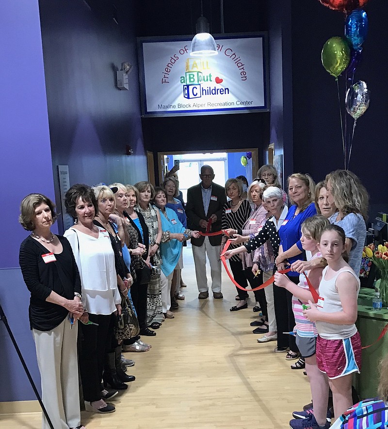 Signal Centers and Friends of Special Children members celebrate the opening of the newest building on the Signal Centers campus. (Contributed photo)
