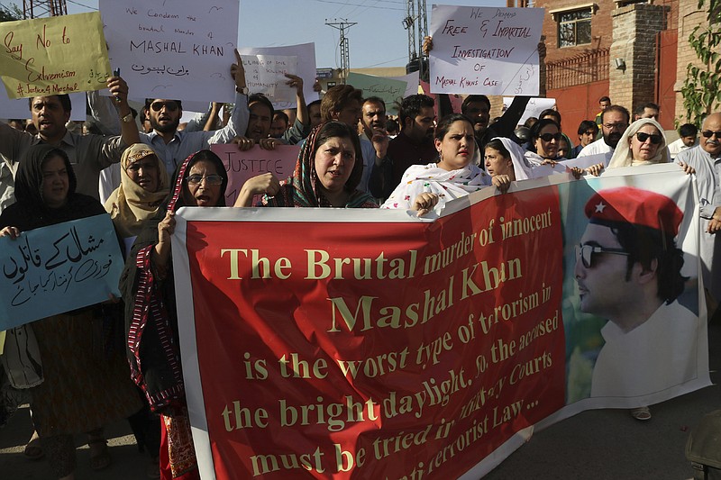 
              In this photo taken on Friday, April. 14, 2017, activists of a Pakistani civil society protest against the killing of a student Mohammad Mashal in Peshawar, Pakistan. Pakistani police say they have arrested 22 suspects in the lynching of the university student who was accused of blasphemy. (AP Photo/Muhammad Sajjad)
            