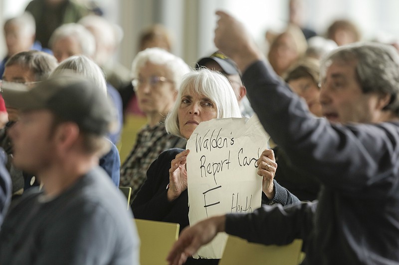 
              FILE - In this April 12, 2017 file photo, people react as House Energy and Commerce Committee Chairman Rep. Greg Walden, R-Ore. speaks at a town hall meeting in The Dalles, Ore. In the auditorium of his old middle school just blocks from where he still lives, the congressman who is a lead author of the stalled House Republican health care bill was treated like the villain in a class play in a town hall meeting. Walden ran into the same anger that has unnerved his Republican colleagues at similar sessions and prompted others to not even bother holding them. (Stephanie Yao Long/The Oregonian via AP, File)
            