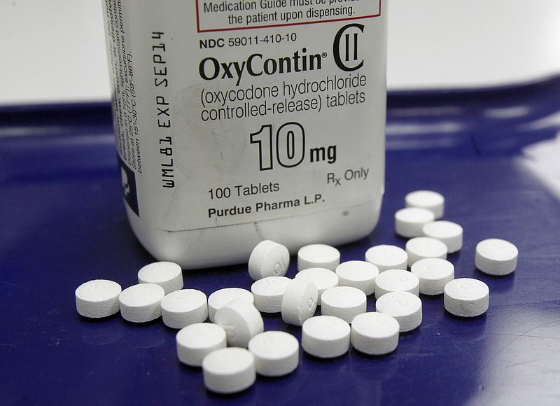 
              FILE - This Feb. 19, 2013, file photo, shows OxyContin pills arranged for a photo at a pharmacy in Montpelier, Vt. Two-thirds of the respondents in a Yahoo/Marist poll released Monday, April 17, 2017, said opioid drugs such as Vicodin or OxyContin are "riskier" to use than pot, even when the pain pills are prescribed by a doctor. (AP Photo/Toby Talbot, File)
            