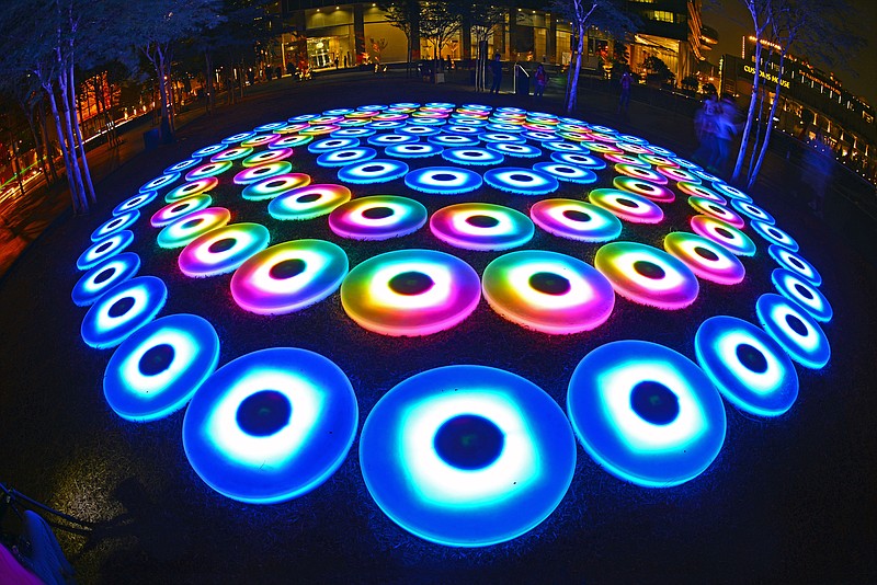 "The Pool" by Jen Lewin is a light installation made of 40,000 LED lights on 106 computer-powered discs arranged in concentric circles.