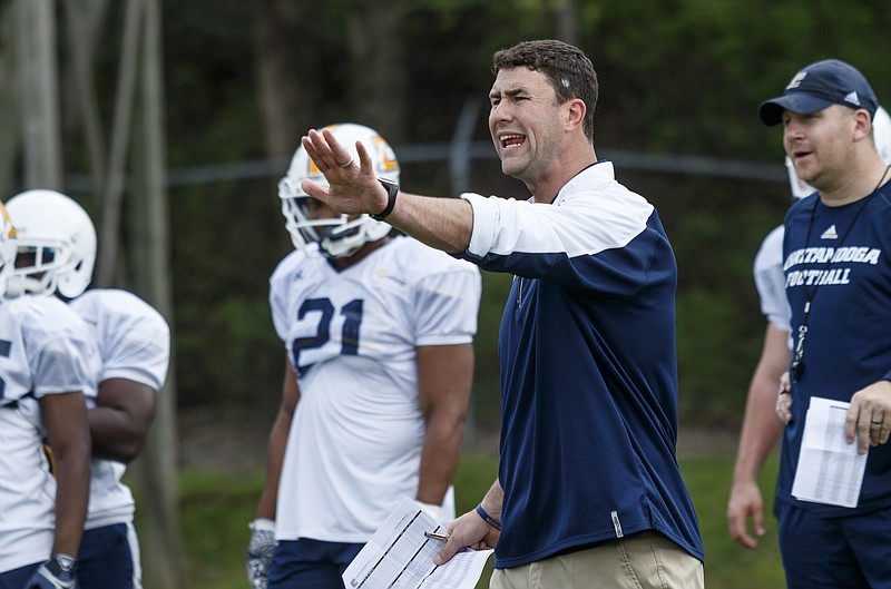 UTC head football coach Tom Arth directs players during spring football practice at Scrappy Moore Field on Saturday, March 25, 2017, in Chattanooga, Tenn.