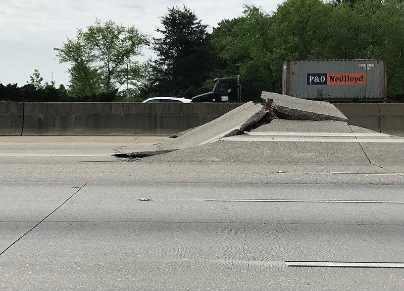 This photo shows a portion of Interstate 20 that buckled because of an underground gas leak in Decatur, Ga., Monday, April 17, 2017. (Eric Stirgus/Atlanta Journal-Constitution via AP)