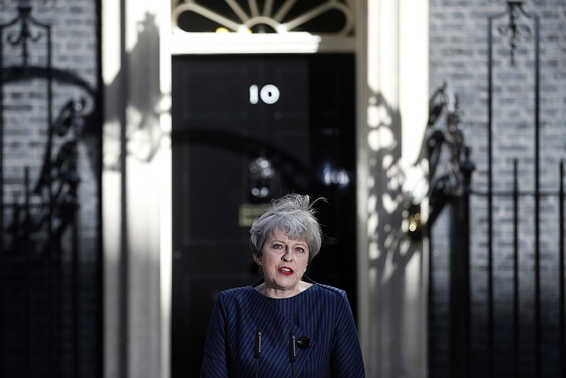 Britain's Prime Minister Theresa May speaks to the media outside her official residence of 10 Downing Street in London, Tuesday April 18, 2017. British Prime Minister Theresa May announced she will seek early election on June 8 (AP Photo/Alastair Grant)