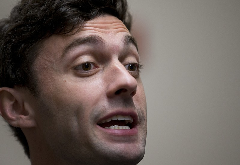 Democratic candidate for Georgia's Sixth Congressional Seat Jon Ossoff talks with reporters at a campaign field office Tuesday, April 18, 2017, in Marietta, Ga. Voters began casting ballots on Tuesday in the special election to fill the House seat vacated by Health and Human Services Secretary Tom Price. (AP Photo/John Bazemore)
