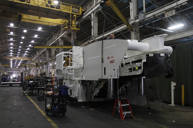 A nearly completed machine sits on the floor of the Roadtec factory in 2010.