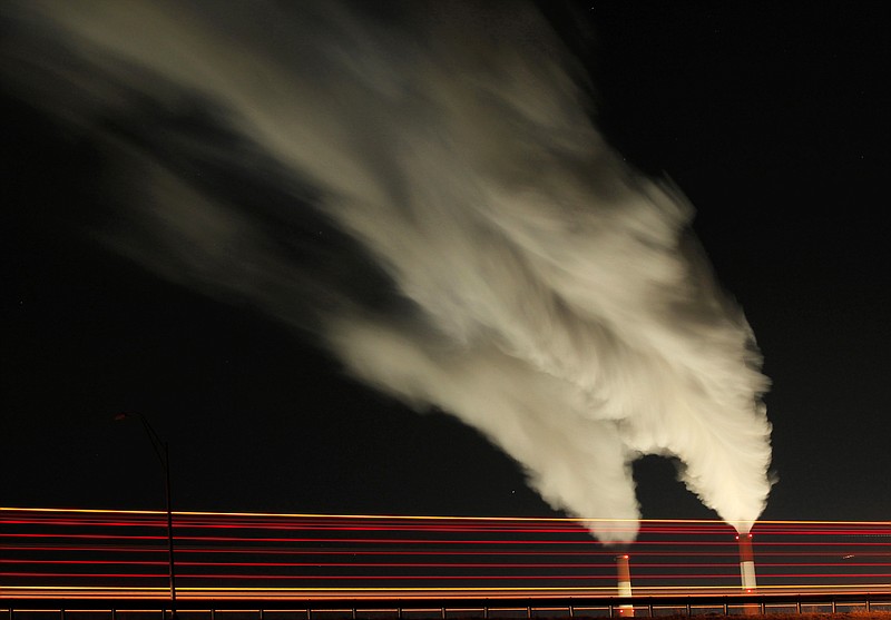 
              FILE - In this Jan. 19, 2012 file photo, smoke rises in this time exposure image from the stacks of the La Cygne Generating Station coal-fired power plant in La Cygne, Kan. The Environmental Protection Agency on Tuesday, April 18, 2017, asked a federal appeals court in Washington to postpone consideration of 2012 rules requiring energy companies to cut emissions of toxic chemicals. The agency said in a court filing it wants to review the restrictions, which were set to kick in next month. (AP Photo/Charlie Riedel, File)
            