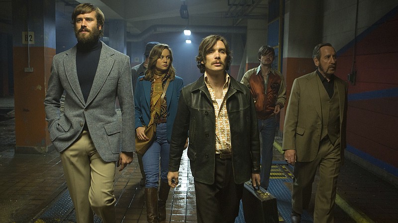 This image released by A24 shows, from left, Armie Hammer, Brie Larson, Cillian Murphy, Sam Riley and Michael Smiley in a scene from "Free Fire." (Kerry Brown/A24 via AP)