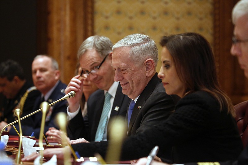 
              U.S. Defense Secretary James Mattis (C), flanked by U.S. Embassy Charge d'Affaires Christopher Henzel (2nd L) and White House Deputy National Security Advisor Dina Powell (R), meets with Saudi Arabia's Deputy Crown Prince and Defense Minister Mohammed bin Salman and his delegation in Riyadh, Saudi Arabia Wednesday, April 19, 2017. (Jonathan Ernst/Pool photo via AP)
            