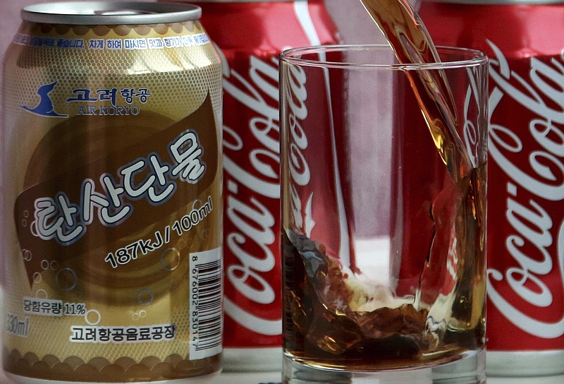 
              In this Tuesday, April 11, 2017, photo, a can of Air Koryo cola, produced by Air Koryo, the country's flagship airline which recently introduced its own brand of cola on flights to and from Beijing is seen in Pyongyang, North Korea. Coca Cola is possibly the world's most recognizable brand, an almost inescapable symbol of the global appeal of American-style consumer culture. There are only two countries in the world where Coke doesn't officially operate, and one of them is North Korea. (AP Photo/Wong Maye-E)
            