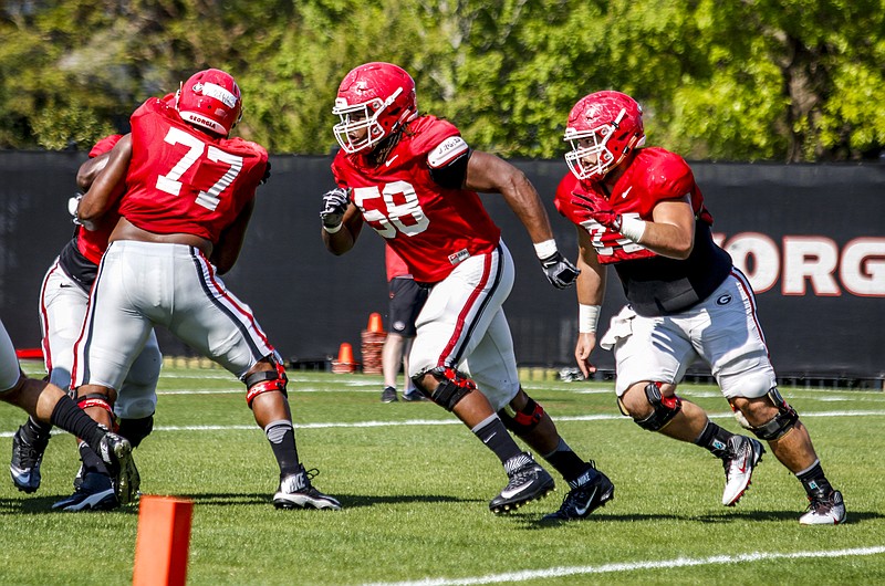 Georgia left guard Pat Allen (58), shown during a recent practice, has been a pleasant surprise as the Bulldogs wrap up spring practice. The G-Day Game is Saturday at Sanford Stadium in Athens.