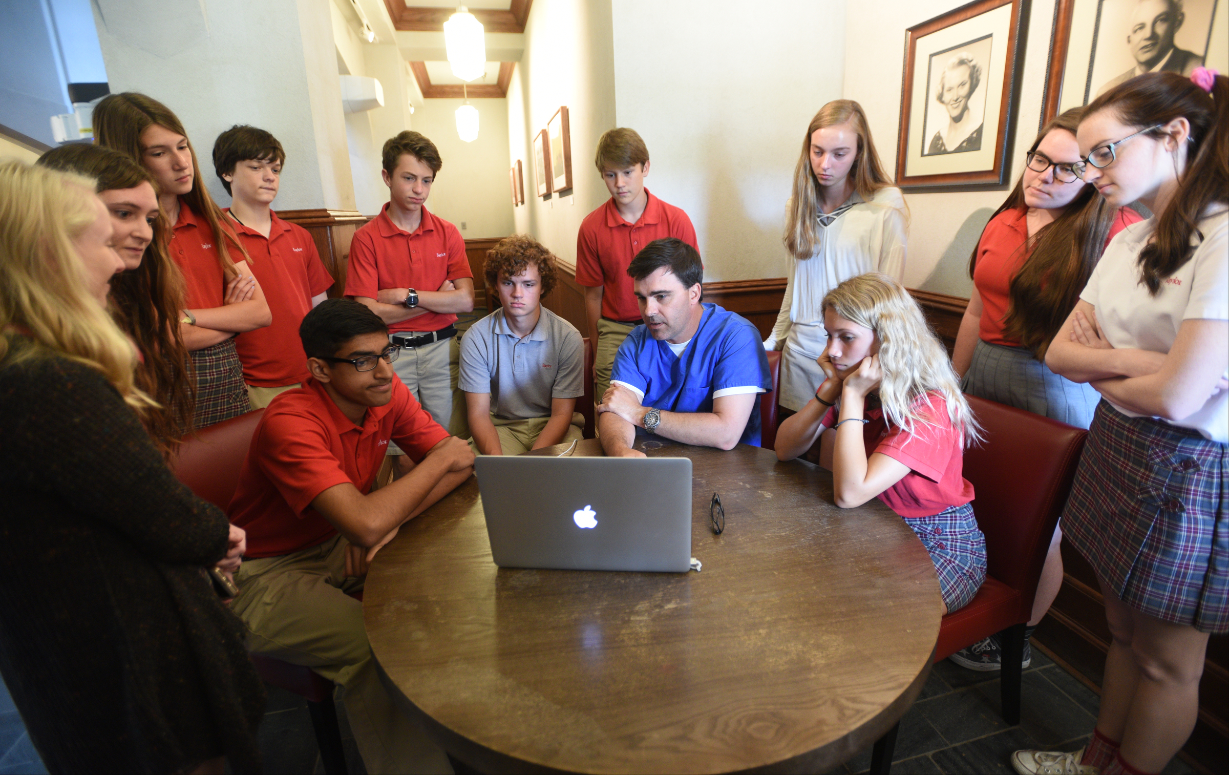 Nurse practitioner Jeremy Smith, seated, second from right, talks Thursday, April 20, 2017 at Baylor with students about how the da Vinci Surgical System is used.