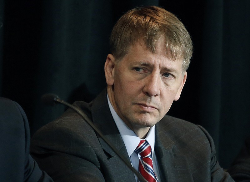 
              FILE - In this Wednesday, Oct. 7, 2015, file photo, Consumer Financial Protection Bureau Director Richard Cordray listens to a speaker during a a hearing in Denver. State and federal authorities are suing Ocwen Financial Corp., saying the mortgage servicing company botched the handling of millions of mortgage accounts. The Consumer Financial Protection Bureau said Thursday, April 20, 2017, that Ocwen generated errors in borrowers' accounts, failed to credit payments, illegally foreclosed on homeowners, and charged borrowers for add-on products without their consent. Ocwen is one of the nation's largest non-bank mortgage lenders. (AP Photo/Brennan Linsley, File)
            