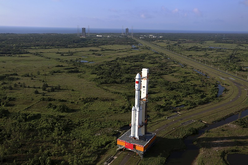 
              In this Monday, April 17, 2017 photo released by China's Xinhua News Agency, a Long March 7 rocket carrying the Tianzhou 1 is transferred to the launching site in Wenchang, south China's Hainan Province. China is preparing to launch its first unmanned cargo spacecraft on a mission to dock with the country's space station. The Tianzhou 1 was due to blast off at 7:41 p.m. (1141 GMT) Thursday atop a latest-generation Long March 7 rocket from China's newest spacecraft launch site. (Zeng Tao/Xinhua via AP)
            