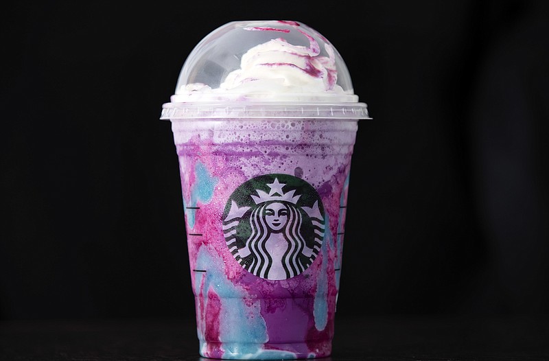 A Starbucks Unicorn Frappuccino drink sits on display, Thursday, April 20, 2017, in Philadelphia. Starbucks' entry into the unicorn food craze was released Wednesday and its popularity was too much for Colorado barista Braden Burson. He posted a video on Twitter complaining that the drink was difficult to make and he's "never been so stressed out" in his life. (AP Photo/Matt Rourke)