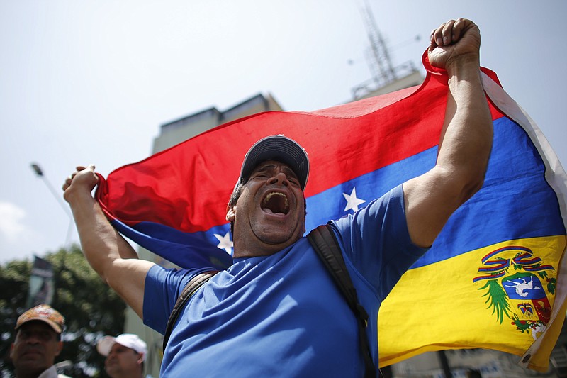 
              A man shouts anti-government slogans during a protest in Caracas, Venezuela, Thursday, April 20, 2017. Venezuela's opposition is calling for another day of protests against President Maduro after mass demonstrations Wednesday resulted in two deaths. (AP Photo/Ariana Cubillos)
            