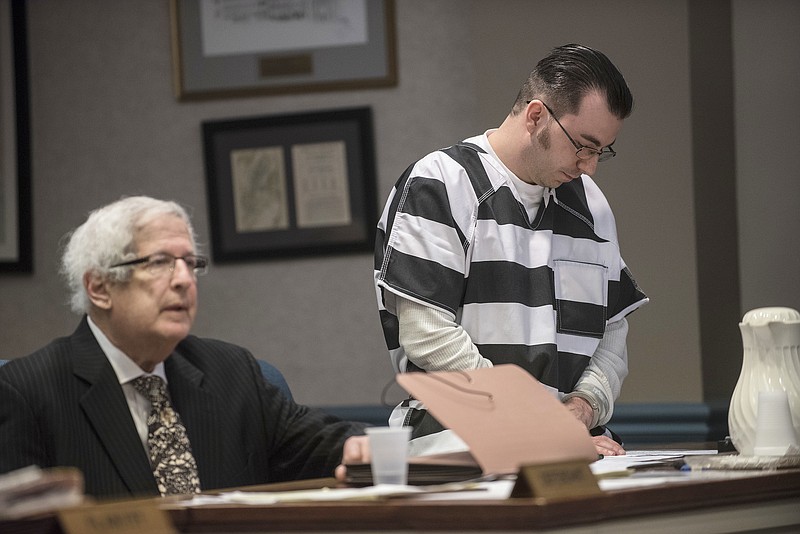 
              Defense Attorney Miles Feinstein listens as Defendant Kristopher Dohm, right, makes a statement for leniency during his sentencing in state Superior Court in Newton,  NJ., Friday, April 21, 2017. Feinstein, who sparked a nationwide search when he fled the state with his two young sons, has been sentenced to 10 years in prison.  (Warren Westura/The New Jersey Herald via AP, Pool)
            