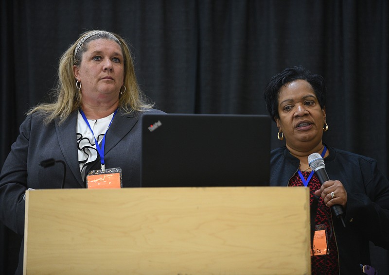Debbie McAdams, left, and Sonya Dobbs speak at Chattanooga Autism Center's conference for parents and educators Friday, April 21, 2017 at the Chattanooga Convention Center.
