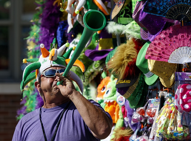 Larry Slaseman plays a vuvuzela as he sells souvenirs on the 1st day of the Riverbend Festival at Ross's Landing on Friday, June 10, 2016, in Chattanooga, Tenn. The festival is celebrating its 35th year, and Thomas Rhett was Friday night's headlining act.