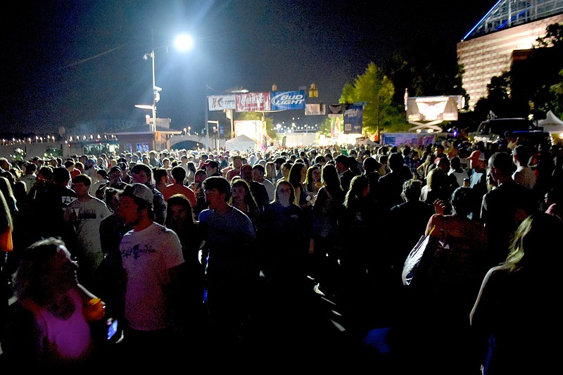 Crowds fill the street at the Riverbend Festival on Sunday, June 7,  2015, in Chattanooga, Tenn.