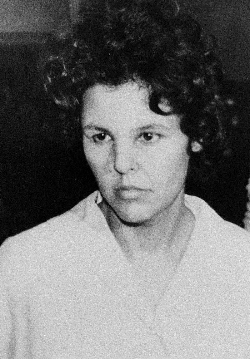 
              FILE - In this Oct. 21, 1981 file photo, Judith Clark is taken into police custody in Nanuet, N.Y. On Friday, April 21, 2017, New York's Parole Board has denied Clark parole. The former Weather Underground radical drove a getaway car in the1981 Brinks armored car robbery that left three people dead. She has served 35 years of a 75-years-to-life sentence. (AP Photo/David Handschuh, File)
            