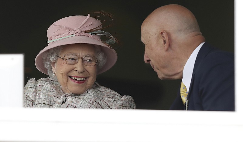 
              Britain's Queen Elizabeth II speaks with an unidentified man at an event at Newbury Racecourse in Newbury England Friday April 21, 2017. The Queen celebrated her 91st birthday on Friday. (Andrew Matthews/PA via AP)
            