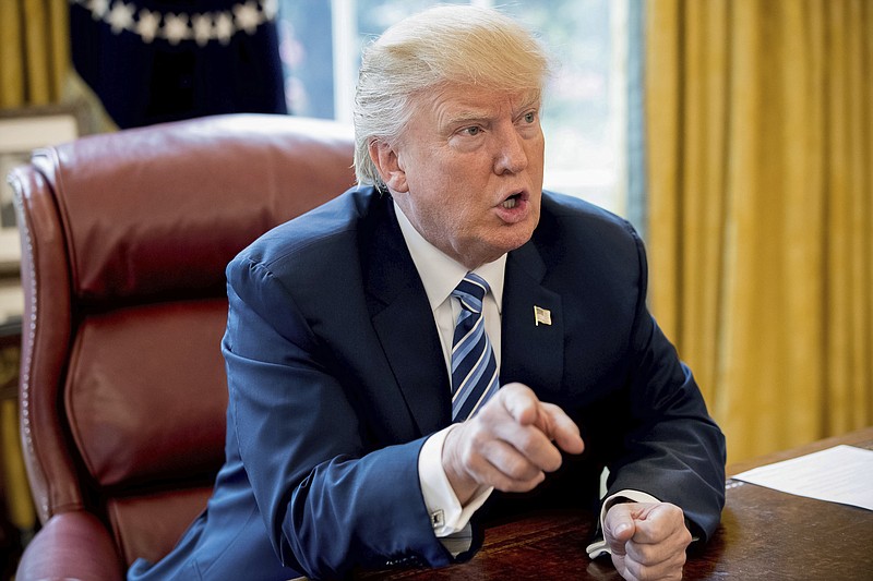 
              President Donald Trump speaks to Associated Press Chief White House Correspondent Julie Pace in the Oval Office in Washington, Wednesday, April 19, 2017. The president said he believes the attack in Paris will "probably help" far-right candidate Marine Le Pen in France's upcoming election. (AP Photo/Andrew Harnik)
            