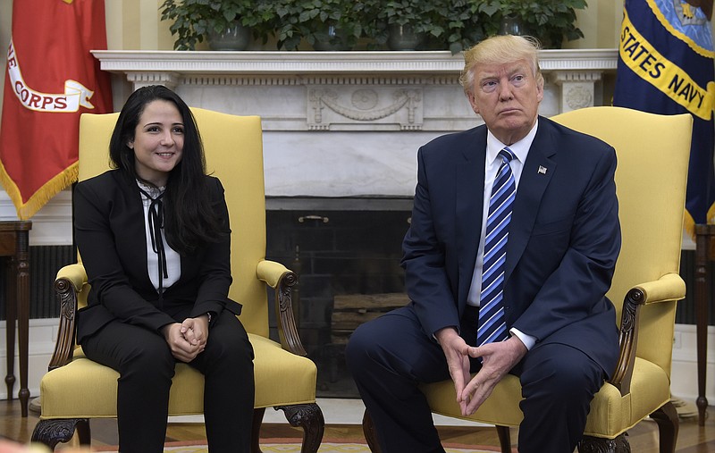 
              President Donald Trump meets with Aya Hijazi, an Egyptian-American aid worker, in the Oval office of the White House in Washington, Friday, April 21, 2017. Hijazi, an Egyptian-American charity worker was freed after nearly three years of detention in Egypt returning to the U.S., Thursday, April 20, 2017. (AP Photo/Susan Walsh)
            