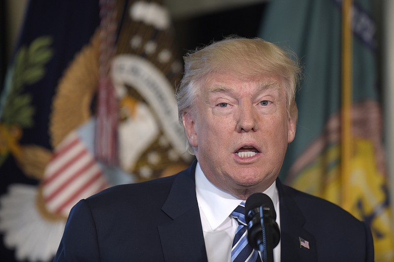 
              President Donald Trump speaks at the Treasury Department in Washington, Friday, April 21, 2017, where he signed an executive order to review tax regulations set last year by his predecessor, as well as two memos to potentially reconsider major elements of the 2010 Dodd-Frank financial reforms passed in the wake of the Great Recession. (AP Photo/Susan Walsh)
            