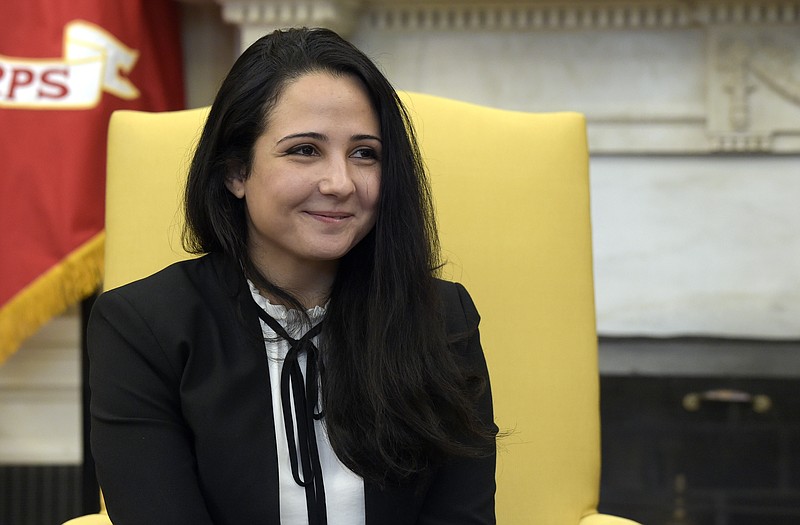 
              Aya Hijazi, an Egyptian-American aid worker, meets with President Donald Trump in the Oval office of the White House in Washington, Friday, April 21, 2017. Hijazi, an Egyptian-American charity worker was freed after nearly three years of detention in Egypt returning to the U.S., Thursday, April 20, 2017. (AP Photo/Susan Walsh)
            